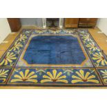 A VERY FINE WOOL RUG the light blue ground with plain central panel within a multicoloured stylized