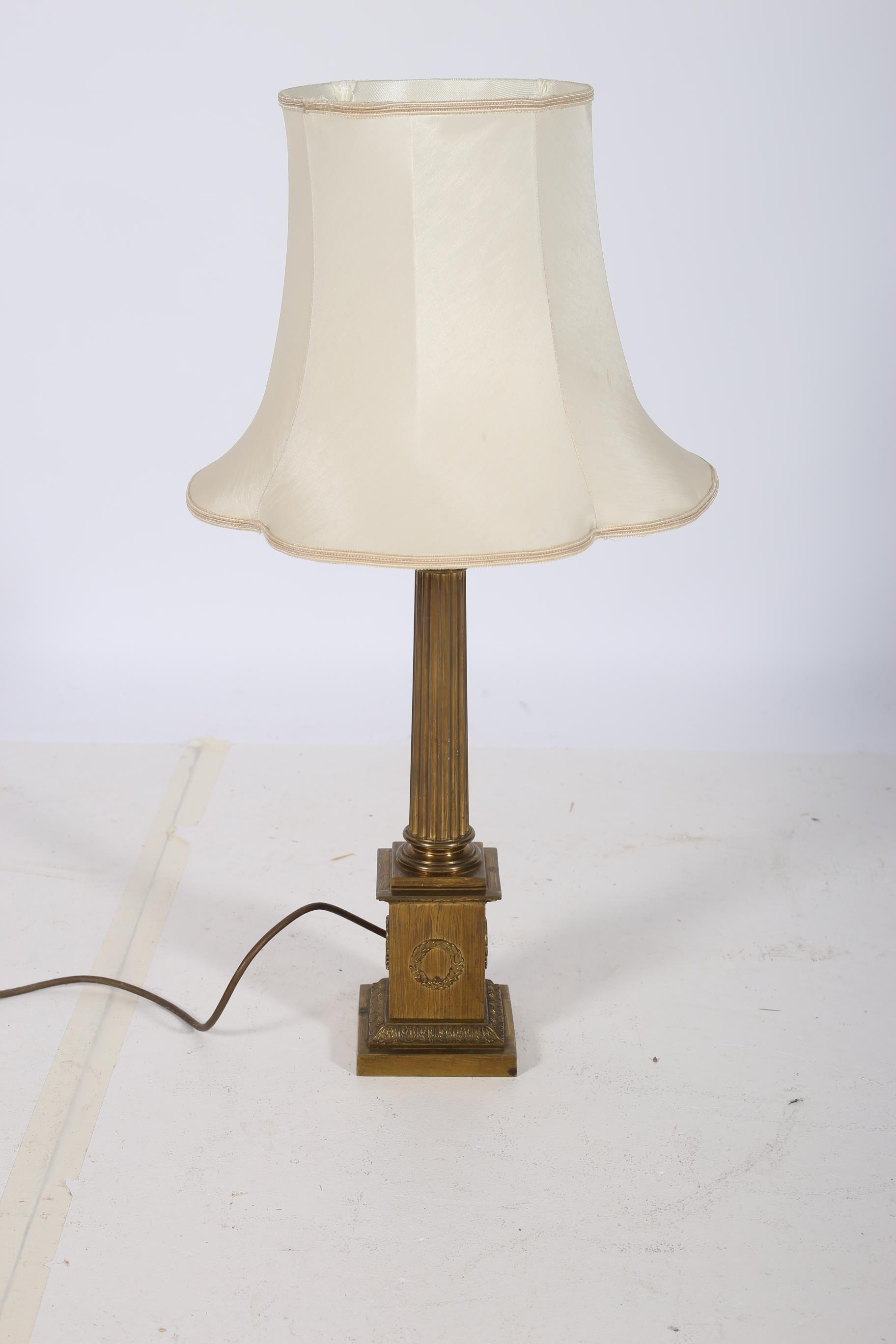 A 19TH CENTURY BRASS CORINTHIAN COLUMN TABLE LAMP the reeded column above a square stepped base