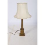 A 19TH CENTURY BRASS CORINTHIAN COLUMN TABLE LAMP the reeded column above a square stepped base