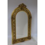 A CONTINENTAL GILTWOOD AND GESSO MIRROR the rectangular bevelled glass plate within a pierced