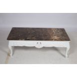 A CONTINENTAL WHITE PAINTED AND MARBLE TOP COFFEE TABLE of rectangular outline with veined marble