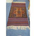 A MOROCCAN KILIM WOOL RUG the multicoloured ground filled with rectangular panels 160cm x 77cm