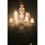 A CAVAN CUT GLASS EIGHT BRANCH CHANDELIER hung in two registers with scroll arms and drip pans hung