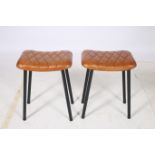 A PAIR OF RETRO HIDE UPHOLSTERED AND BLACK METAL LOW STOOLS each with a rectangular seat with