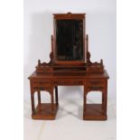 AN ARTS AND CRAFTS MAHOGANY AND WALNUT DRESSING TABLE the superstructure with bevelled glass mirror