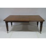 A WILLIAM lV MAHOGANY TELESCOPIC DINING TABLE of rectangular outline with rounded corners and one