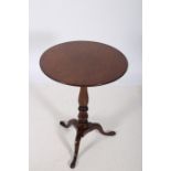 A GEORGIAN MAHOGANY LAMP TABLE the circular moulded top above a baluster column on tripod support