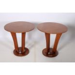 A PAIR OF CONTEMPORARY CHERRYWOOD LAMP TABLES each of circular form raised on a shaped support on a