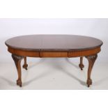 A CHIPPENDALE DESIGN MAHOGANY DINING TABLE of rectangular outline with rounded ends and one loose