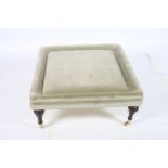 A VICTORIAN DESIGN MAHOGANY AND UPHOLSTERED STOOL of rectangular outline on baluster legs with