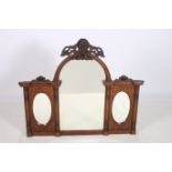 AN EDWARDIAN MAHOGANY INLAID COMPARTMENTED OVERMANTLE MIRROR with carved cresting above a