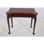 A GOOD GEORGIAN MAHOGANY FOLD OVER GAMES TABLE the rectangular hinged top with eared corners