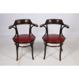 A PAIR OF BENTWOOD ELBOW CHAIRS of typical form with hide upholstered seats