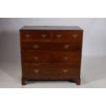 A 19TH CENTURY MAHOGANY AND SATINWOOD INLAID CHEST of rectangular outline the shaped top above two