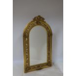 A CONTINENTAL GILTWOOD AND GESSO MIRROR the rectangular bevelled glass plate within a pierced