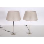 A PAIR OF CONTEMPORARY CHROME TABLE LAMPS each with a cylindrical column on rectangular base with