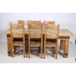 A SEVEN PIECE PINE BREAKFAST SUITE comprising six leather back chairs with panelled seat on square