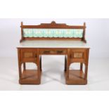 AN ARTS AND CRAFTS MAHOGANY AND WALNUT WASH STAND the superstructure with tiled panels above a
