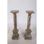 A PAIR OF CONTINENTAL SIENNA VEINED MARBLE AND GILT BRASS PEDESTALS each of square form above a