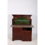 AN ART NOUVEAU MAHOGANY WASH STAND the superstructure with tiled inset and moulded shelves above a