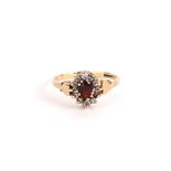 A 9CT GOLD DIAMOND AND RUBY DRESS RING
