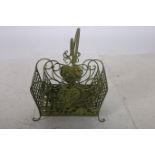 TWO WROUGHT IRON BASKETS each with lattice work panels and carrying handles on scroll legs the