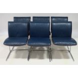 A SET OF SIX BLUE HIDE UPHOLSTERED AND CHROME DESIGNER DINING CHAIRS each with scroll over back and