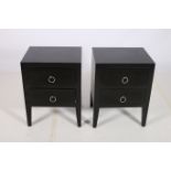 A PAIR OF CONTEMPORARY EBONISED CHESTS each of rectangular outline with two frieze drawers and