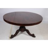 A 19TH CENTURY ROSEWOOD POD TABLE the circular moulded top above a baluster column on carved tripod