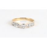 A 9CT GOLD AND DIAMOND DRESS RING