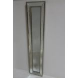 A CONTEMPORARY SILVER FRAMED COMPARTMENTED MIRROR of rectangular form with bevelled glass panels