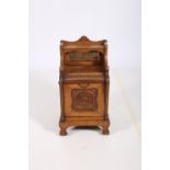 A 19TH CENTURY CARVED OAK FUEL BIN the superstructure with moulded shelf above an open and hinged