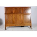 A PAIR OF EDWARDIAN MAHOGANY AND SATINWOOD INLAID BED END the rectangular headboard with oval