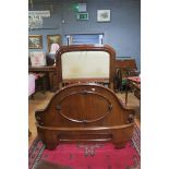 A 19TH CENTURY MAHOGANY BED the rectangular arched headboard with upholstered panel on square