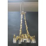 A FINE 19TH CENTURY BRASS AND CUT GLASS EIGHT BRANCH CHANDELIER with pierced foliate circlet