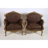 A PAIR OF CONTINENTAL GILTWOOD AND UPHOLSTERED ARMCHAIRS each with a foliate and flowerhead