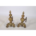 A PAIR OF 19TH CENTURY BRASS AND STEEL ANDIRONS each with knopped column with flame finial above a