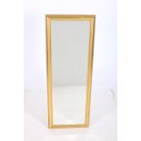 A CONTINENTAL GILT FRAMED MIRROR the rectangular bevelled glass plate within a moulded frame 121cm