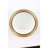 A CONTINENTAL GILT FRAME AND EBONISED MIRROR the circular bevelled glass plate with ebonised slip