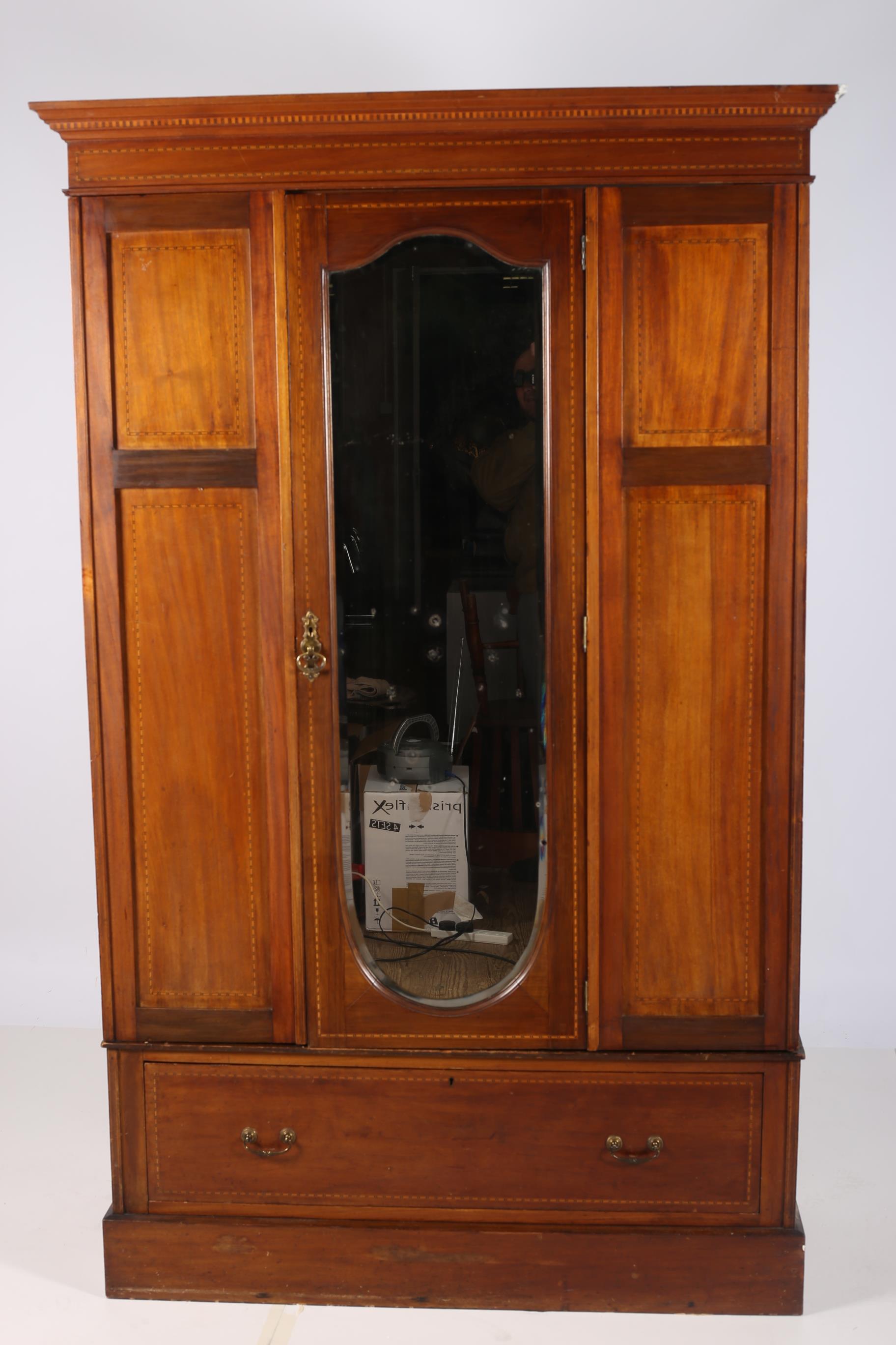 A 19TH CENTURY MAHOGANY AND SATINWOOD INLAID WARDROBE the moulded cornice above a bevelled glass