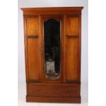 A 19TH CENTURY MAHOGANY AND SATINWOOD INLAID WARDROBE the moulded cornice above a bevelled glass