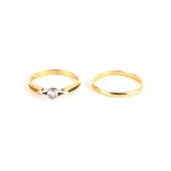 AN 18ct GOLD AND DIAMOND SOLITAIRE DRESS RING together with an 18ct gold wedding band