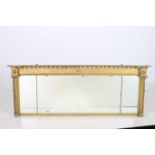 A 19TH CENTURY GILTWOOD AND GESSO COMPARTMENTED OVERMANTLE MIRROR of inverted breakfront outline