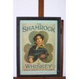 A FRAMED ADVERTISEMENT MIRROR SHAMROCK WHISKEY INSCRIBED KIRKER GREER & CO LTD BELFAST 58cm X 39cm