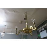 TWO BRASS THREE BRANCH CENTRE LIGHTS together with a frosted glass and brass centre light (3)