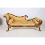 A CONTINENTAL GILTWOOD AND STAINED WOOD DOUBLE SCROLL END CHAISE LONGUE the shaped top rail above