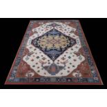A BEIGE AND RUST GROUND PATTERNED RUG the central panel filled with stylized figures flowers and