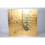 A TWO FOLD LACQUERED SCREEN decorated with flowerheads and foliage 150cm x 140cm