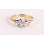 A 9CT DIAMOND DRESS RING .