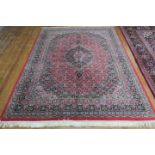 A BIDJAR WOOL RUG the light red and light blue ground with central panel filled with stylized